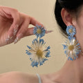 Blue Sunflower Earrings With A Seaside Holiday Resort Style